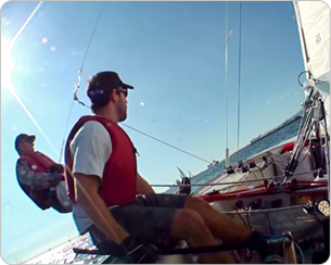 A man sitting on top of a boat.