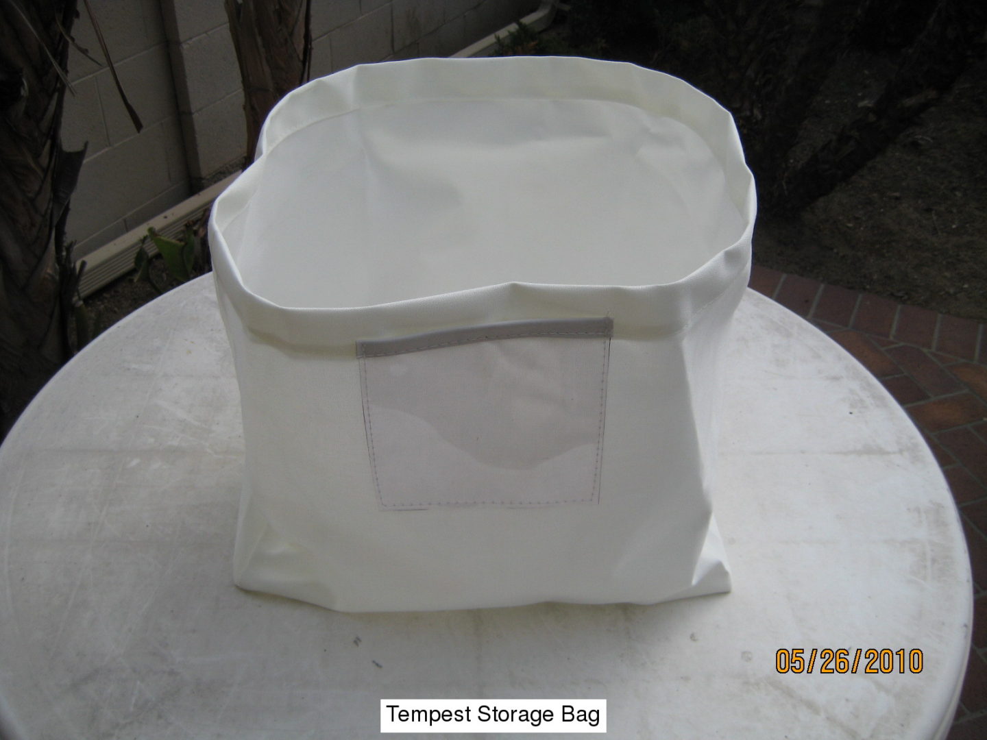 A white bag sitting on top of a table.