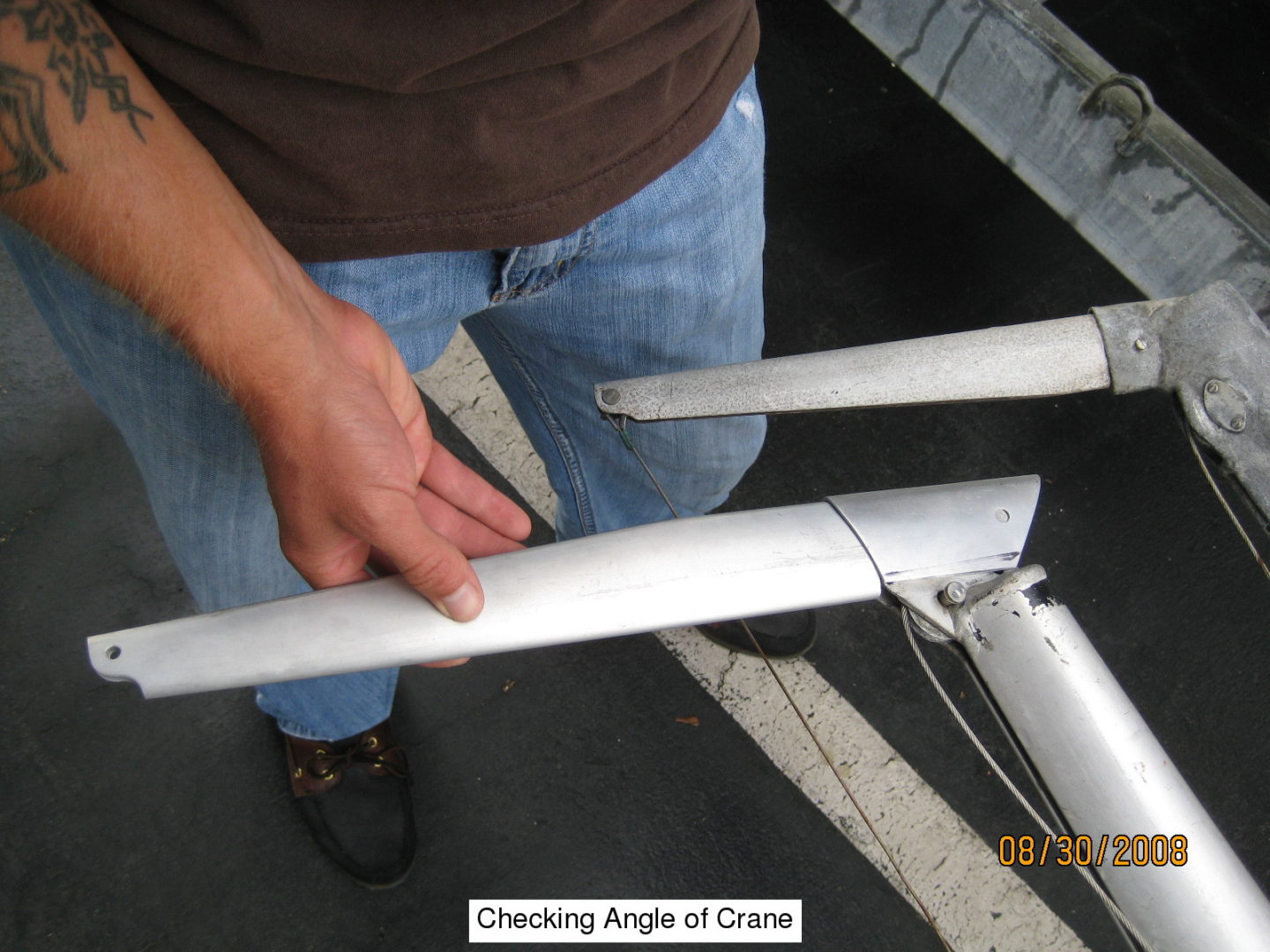 A man holding onto the side of a bicycle rack.