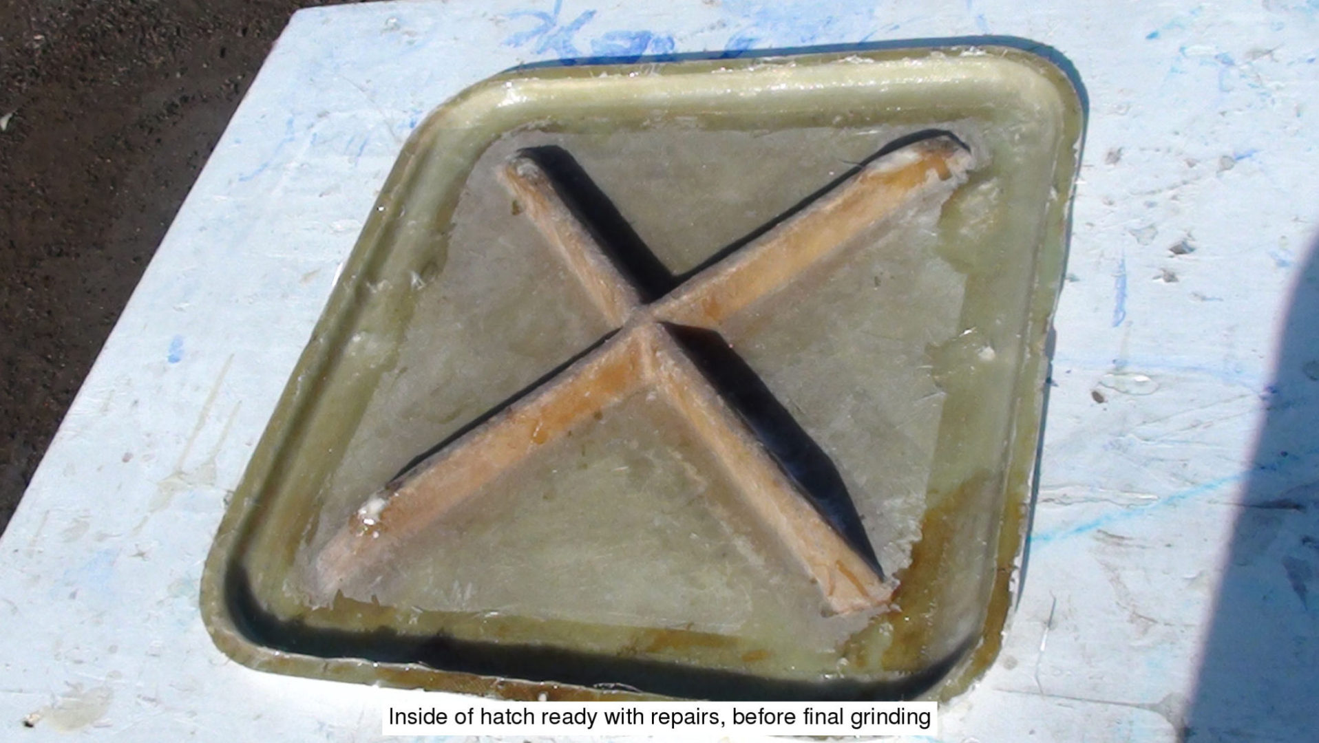 A cross shaped match is sitting on the pan.