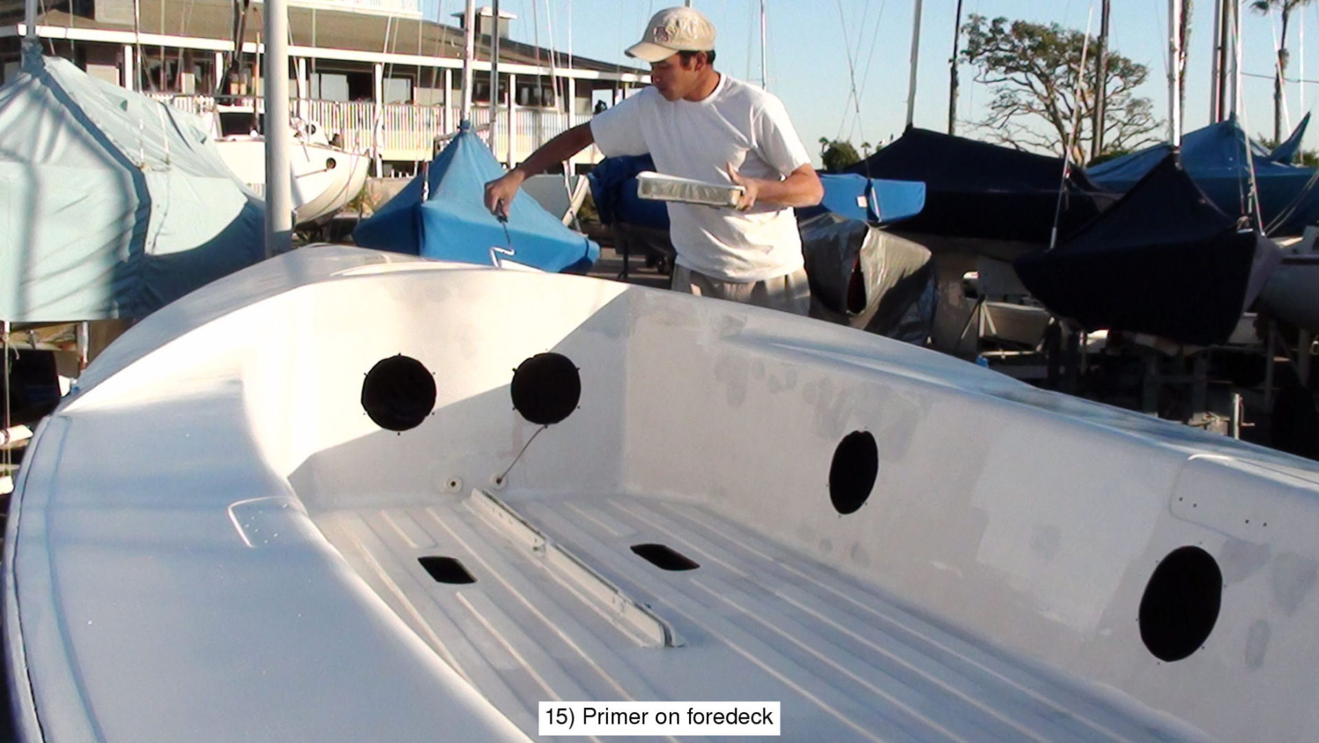 A man in a boat with two holes for the handles.