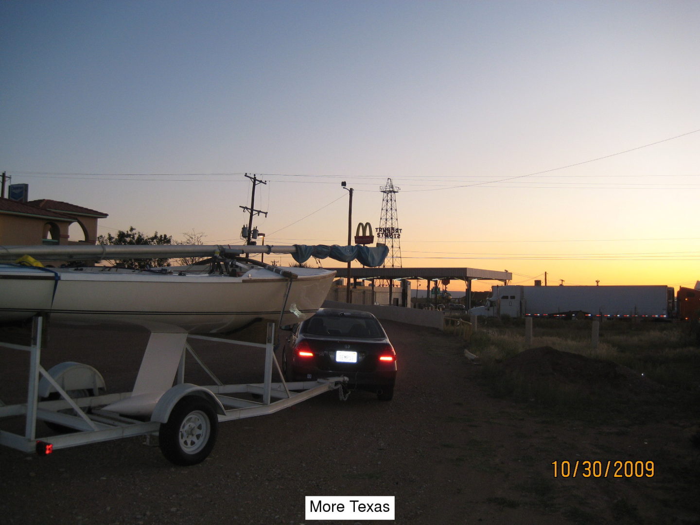 A boat is parked on the side of a road.