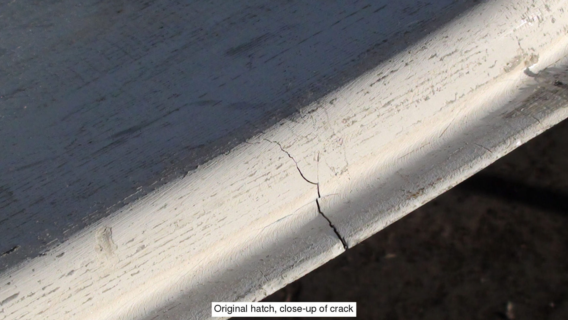 A crack in the side of a building.