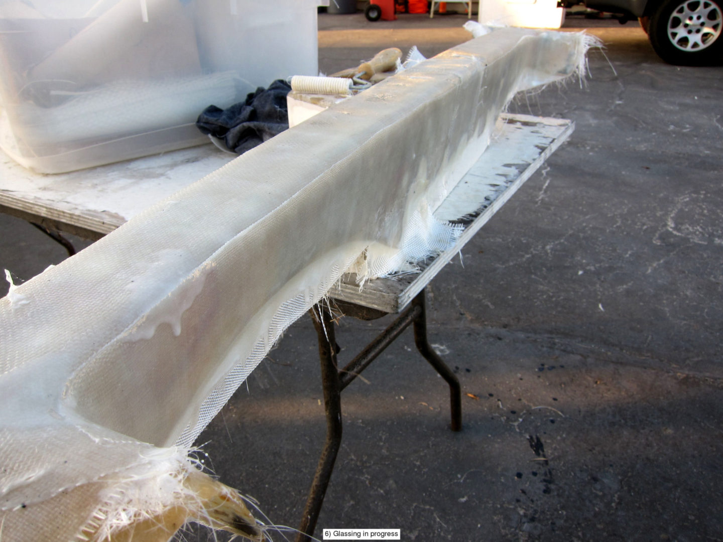 A table with some white plastic wrapped in it