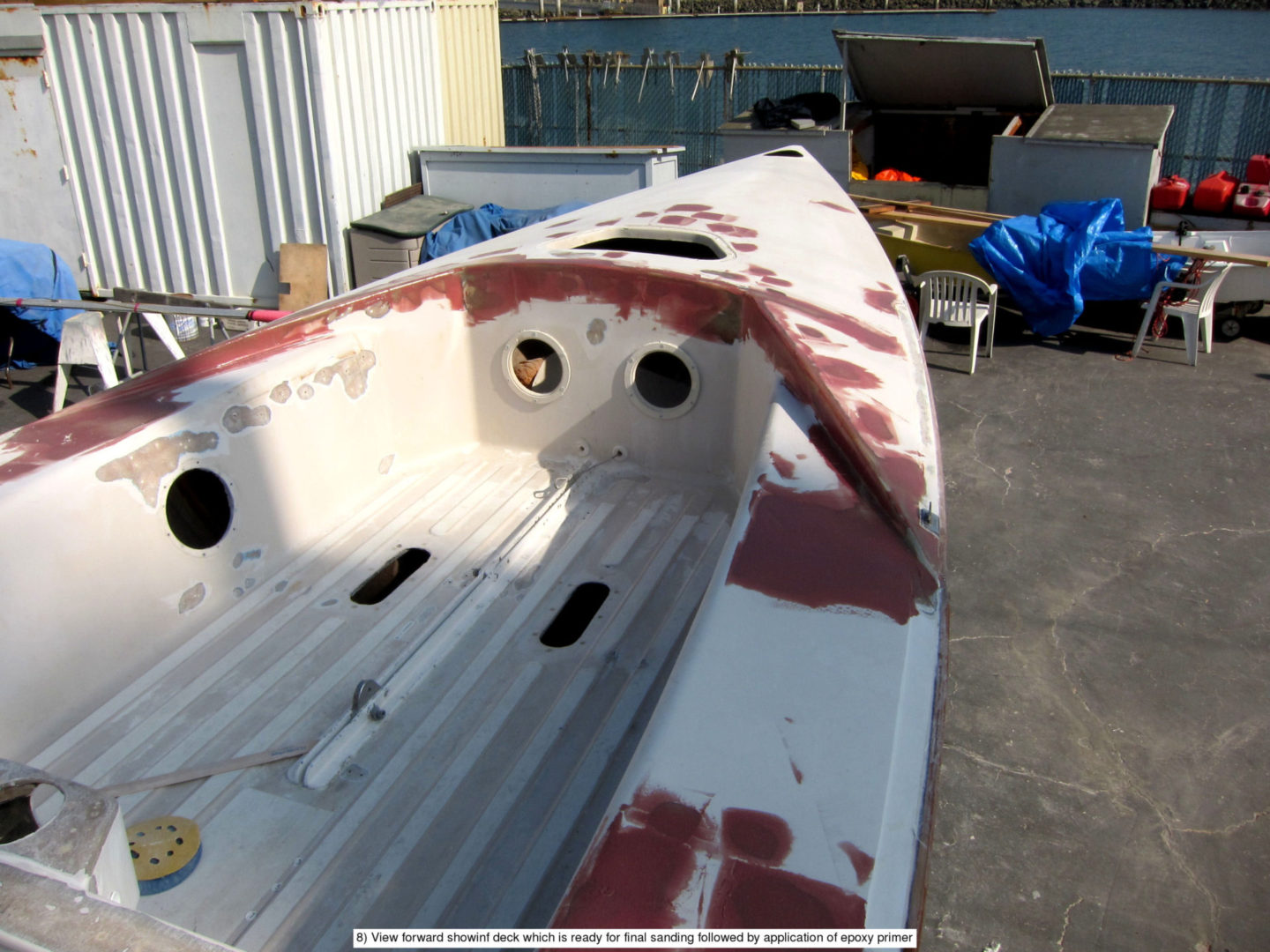 A boat that is painted white and red.