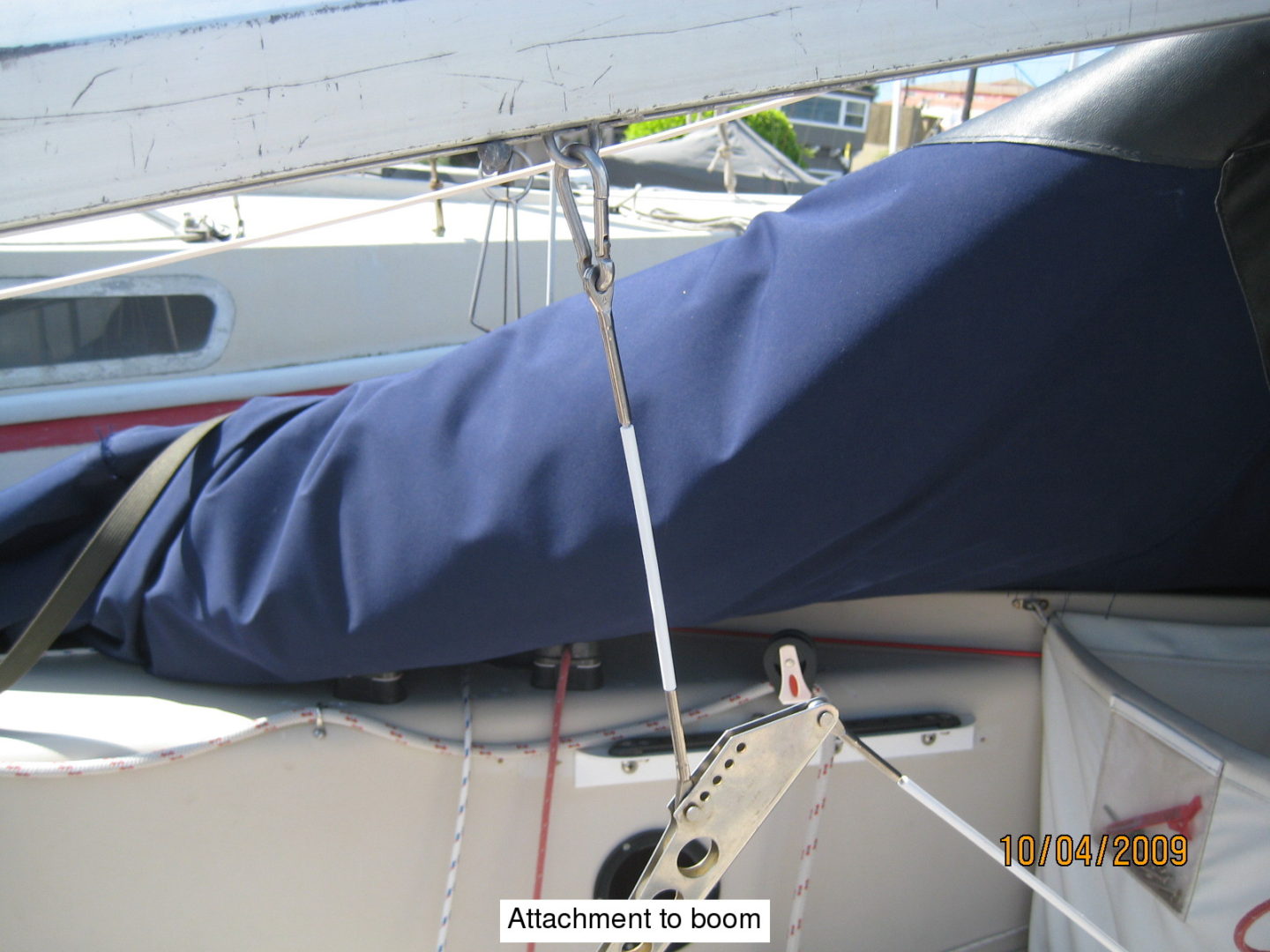 A blue cover is attached to the side of a boat.