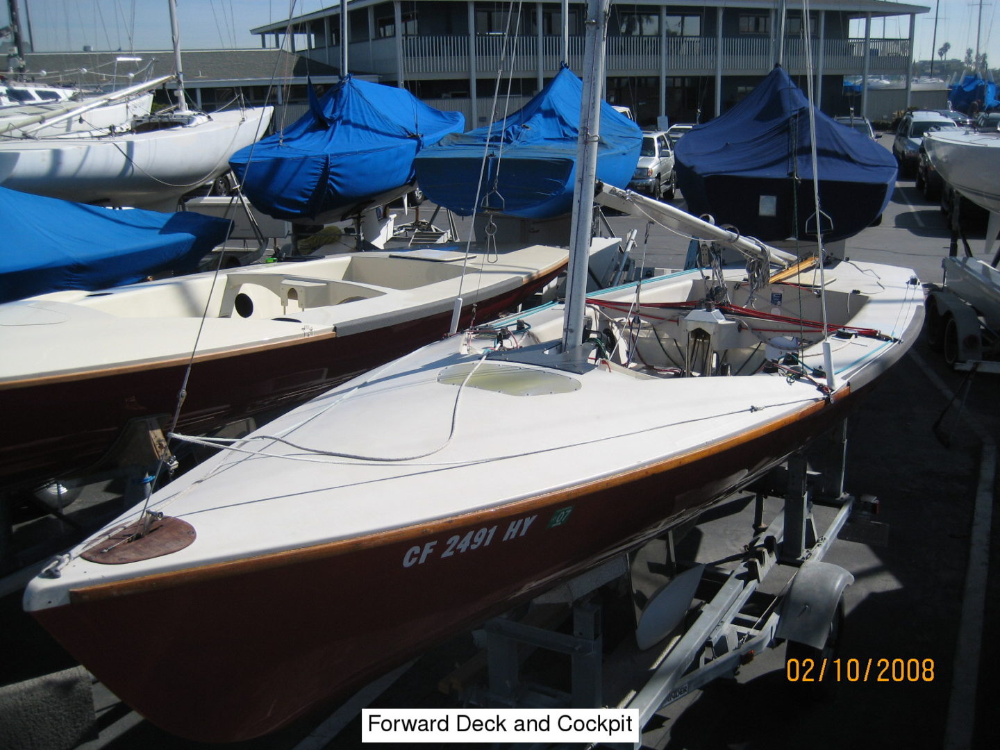 A row of boats parked in the water.