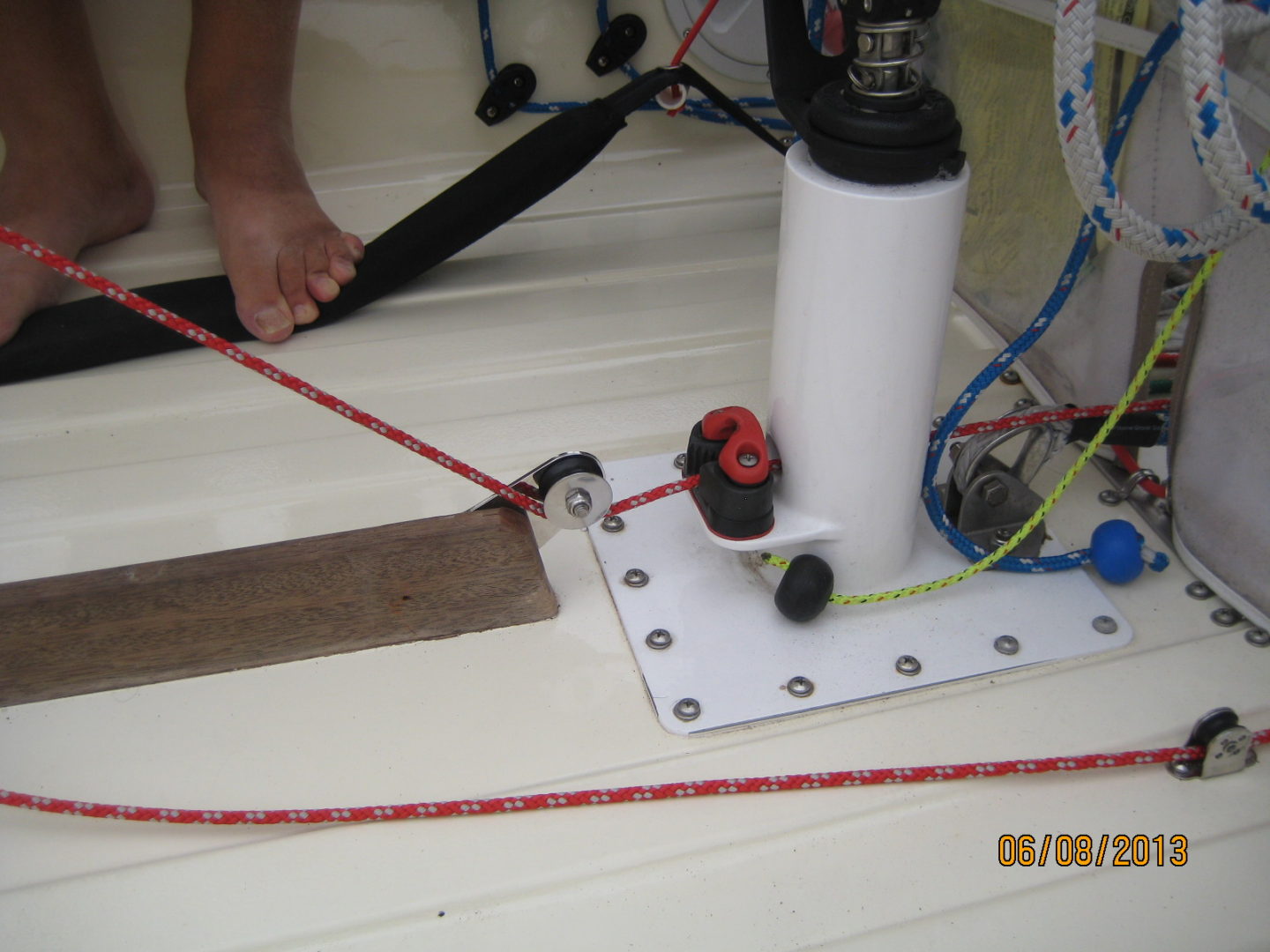 A person is working on the bottom of a boat.