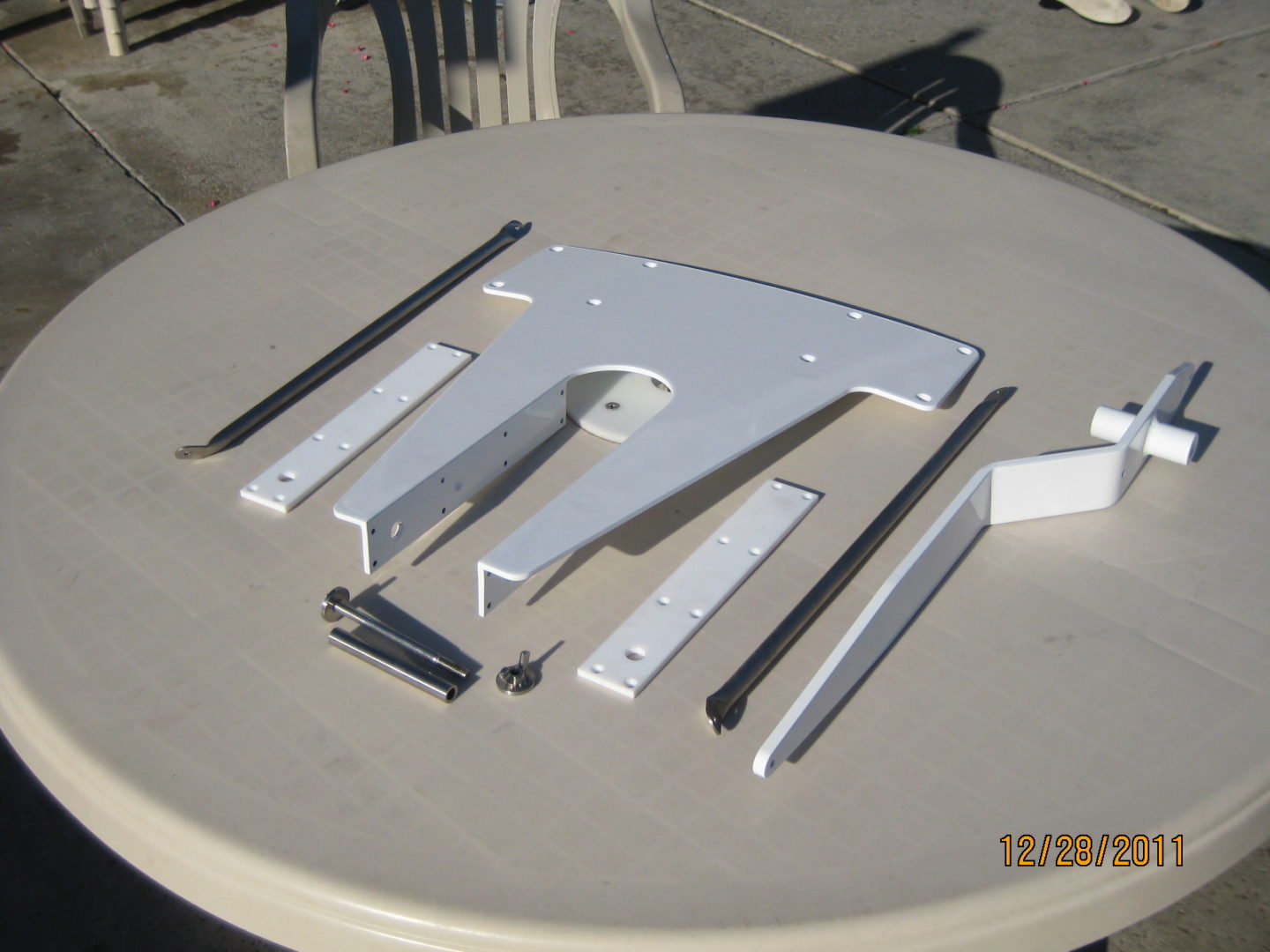 A table with some parts of the frame laid out on it