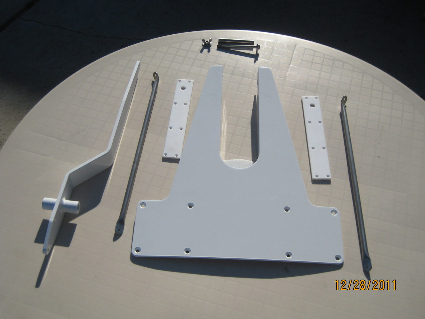 A white table with some parts of the top