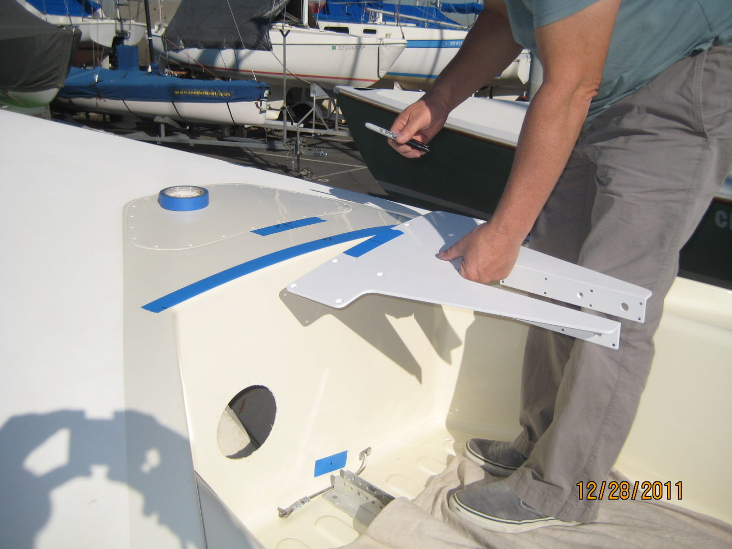 A man holding the side of a boat