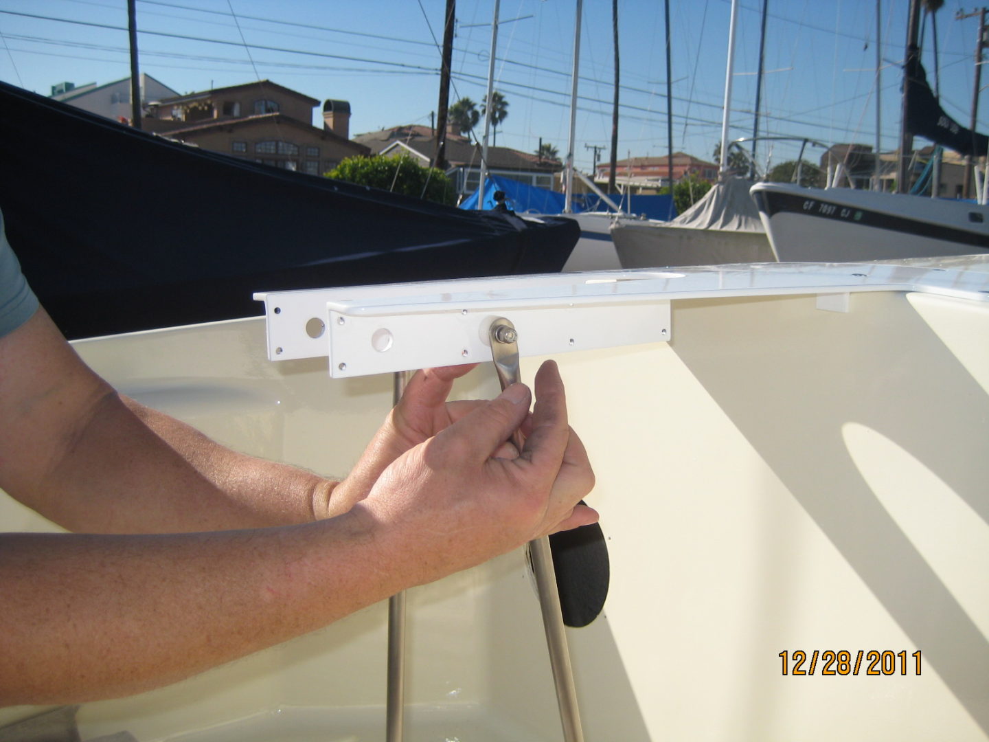 A person holding the side of a boat