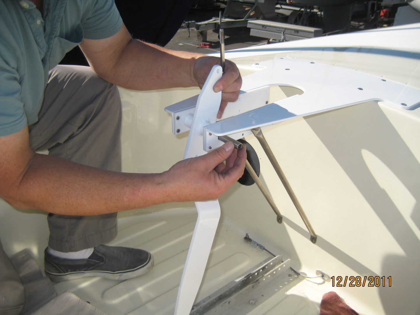 A man working on the side of a boat.