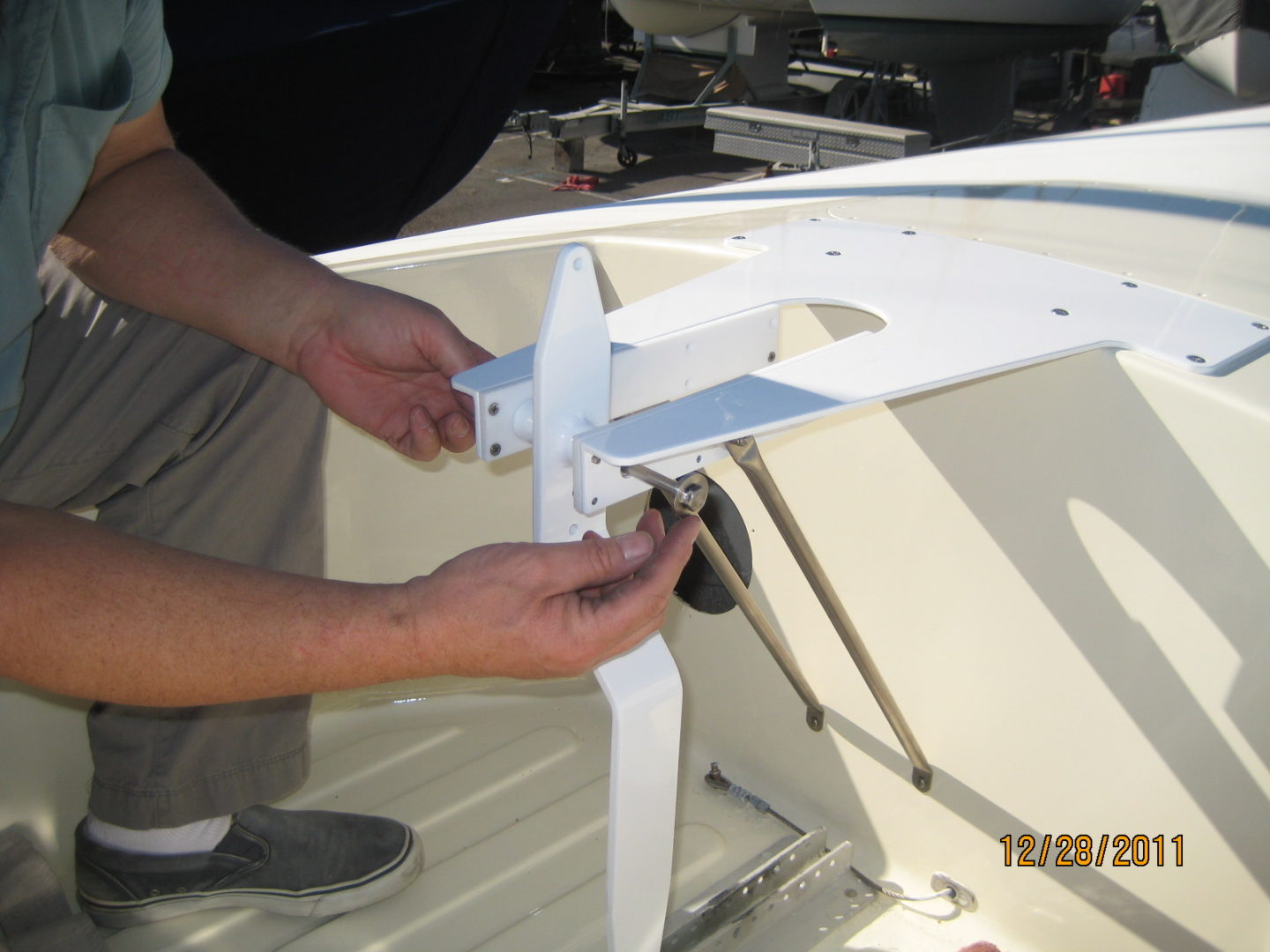 A man is holding the bottom of a boat