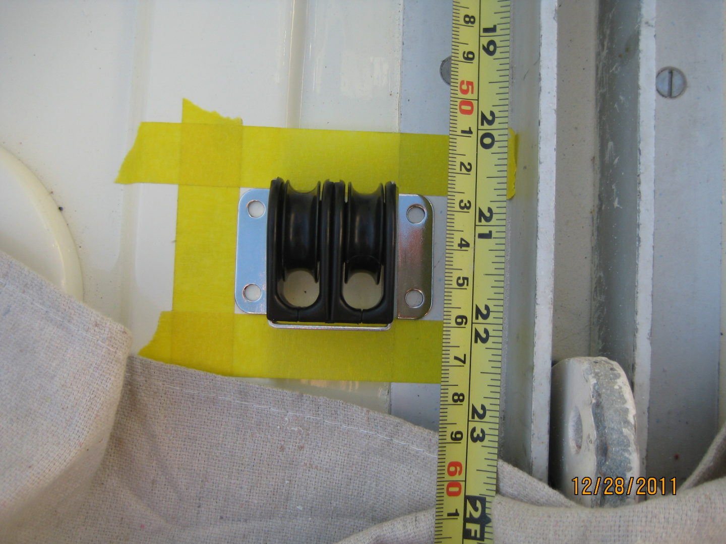 A yellow tape measure and a piece of cloth