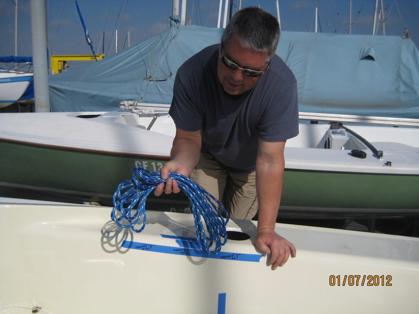 A man is tying up the boat