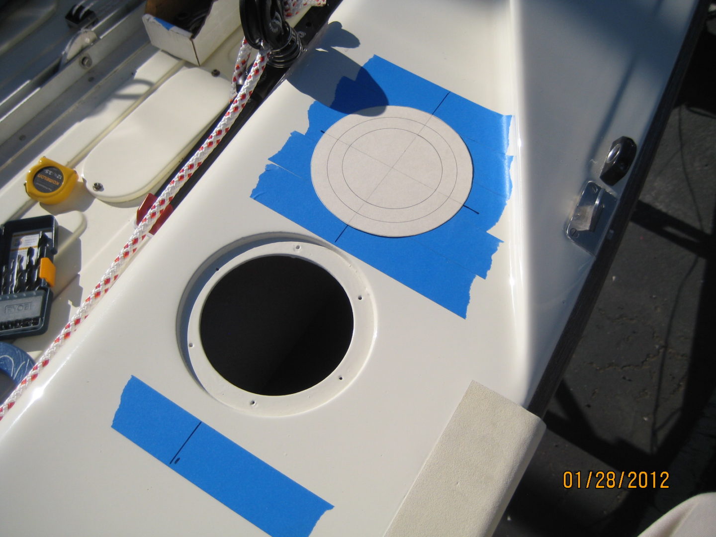 A white table with blue tape on it