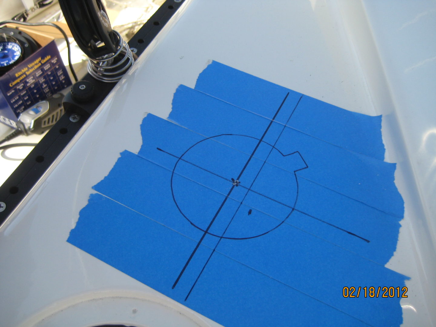 A blue sheet of paper with a circle drawn on it.