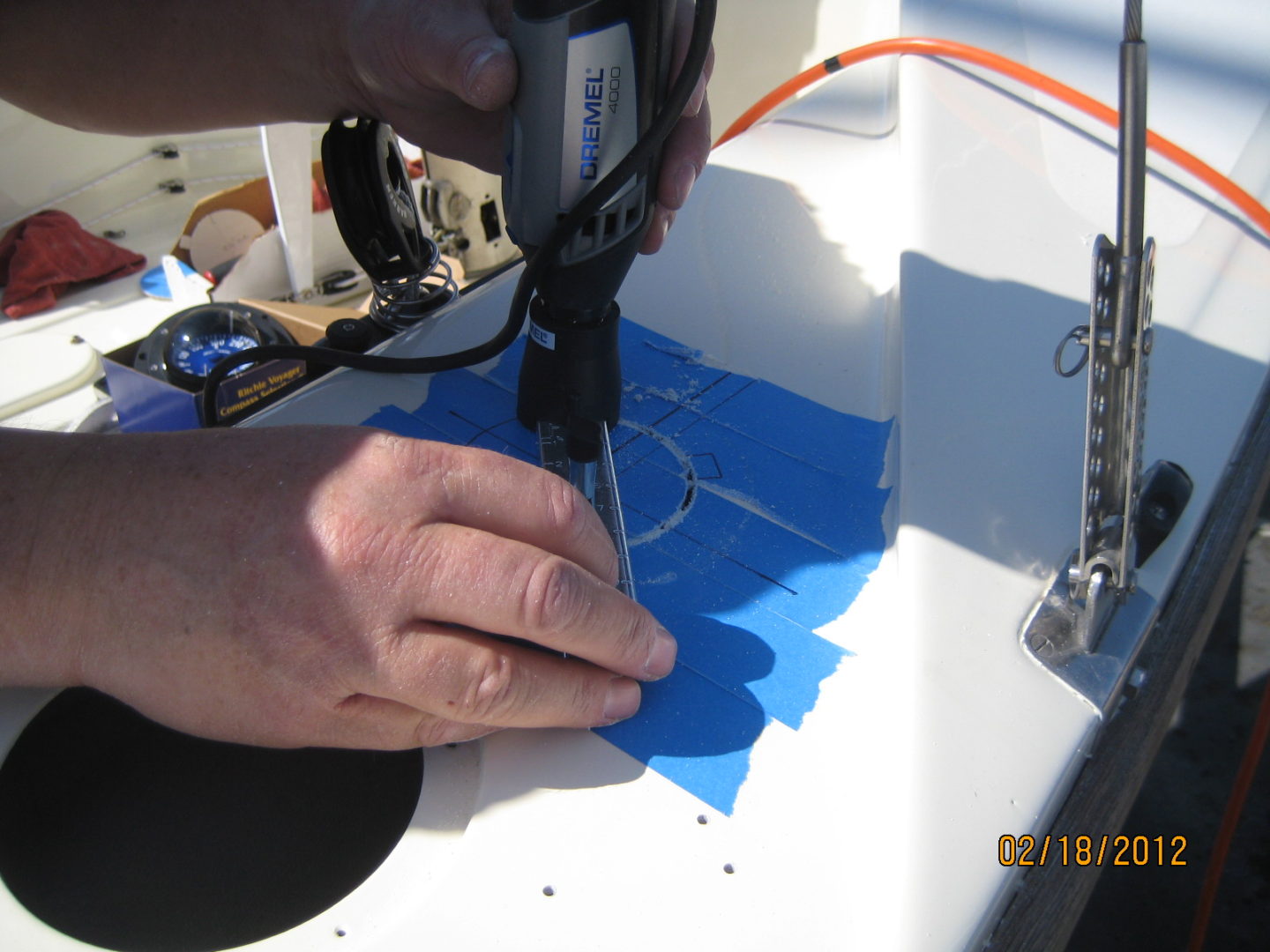 A person using a pair of scissors to cut paper.