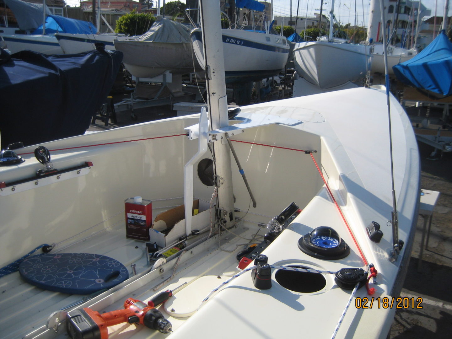 A boat with two oars and a fire hydrant on the side.