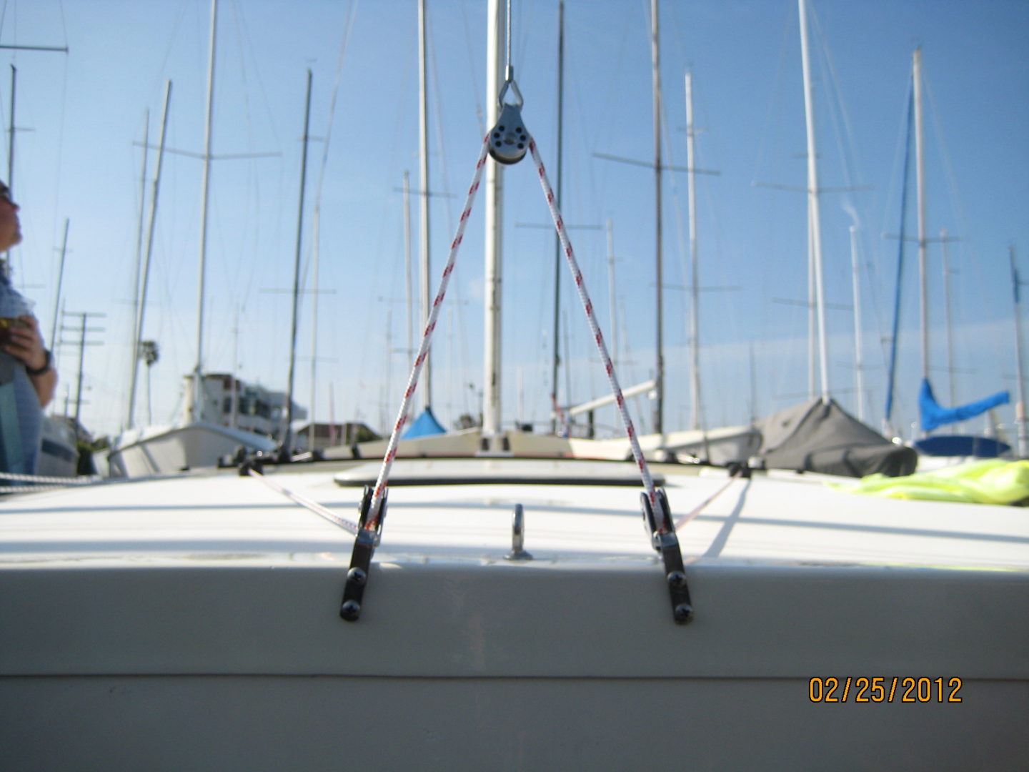 A boat is parked in the water with many masts.