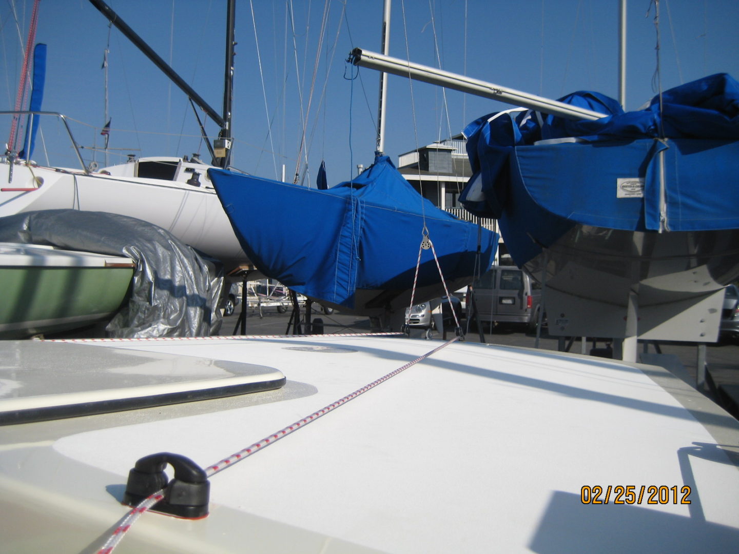 A boat is docked with several other boats.