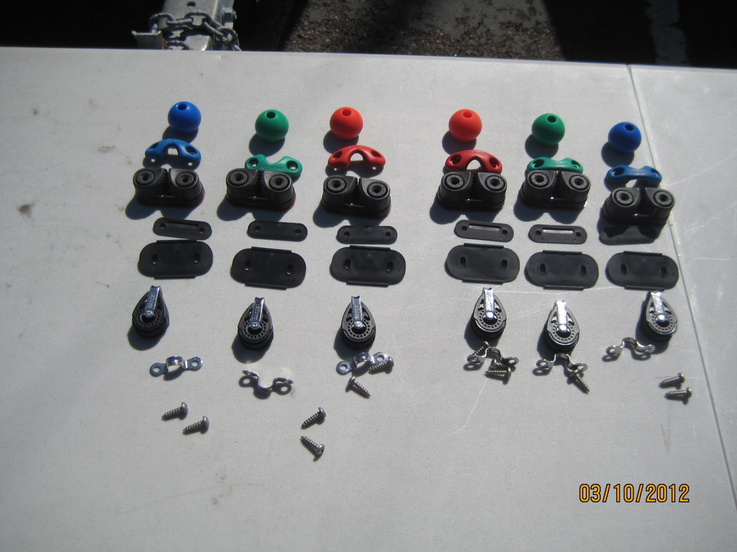 A bunch of different colored knobs on the side of a table