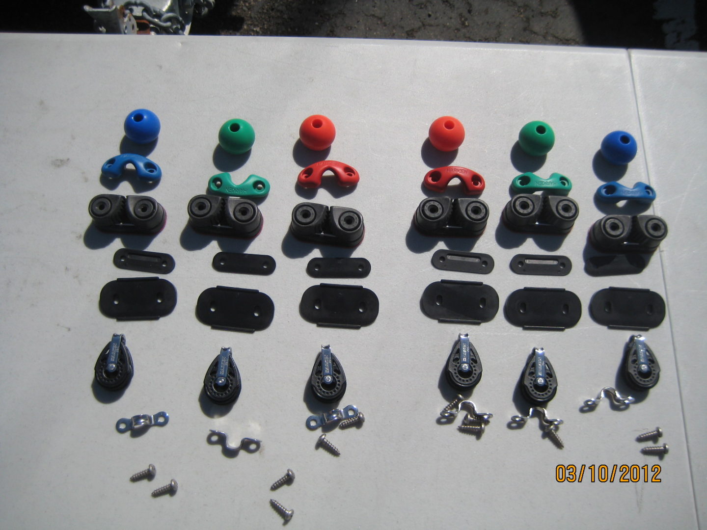 A table with many different types of knobs and some are colored.