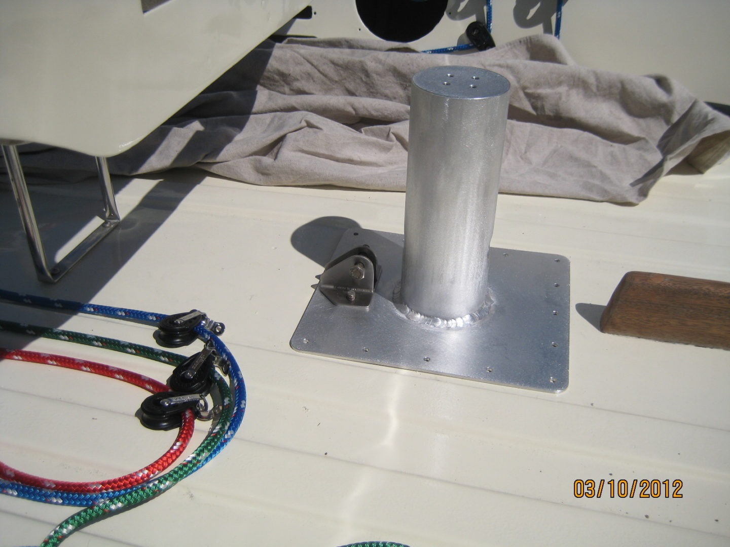 A metal pole sitting on top of a boat.