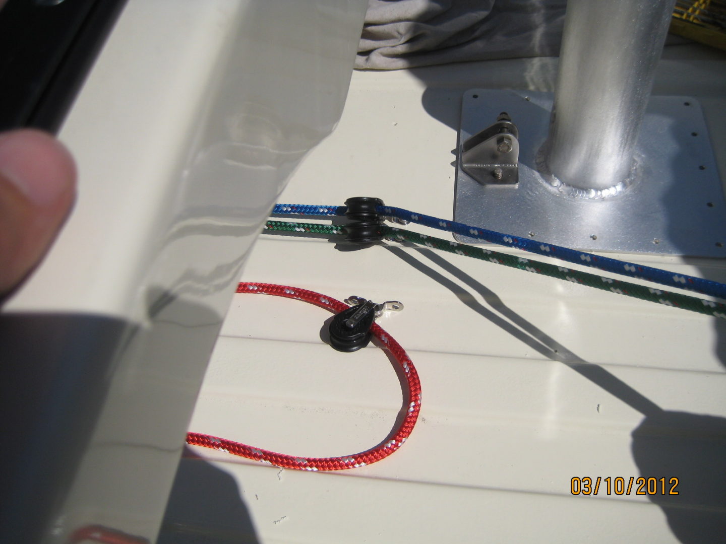 A close up of wires on the side of a boat.