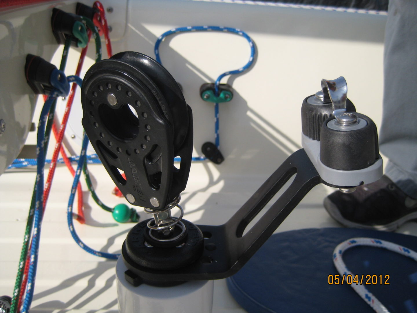 A close up of the pulley on a boat