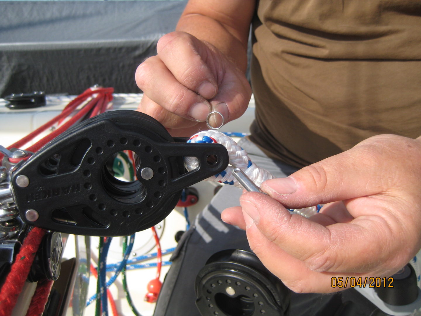 A person is working on a wire with some wires.