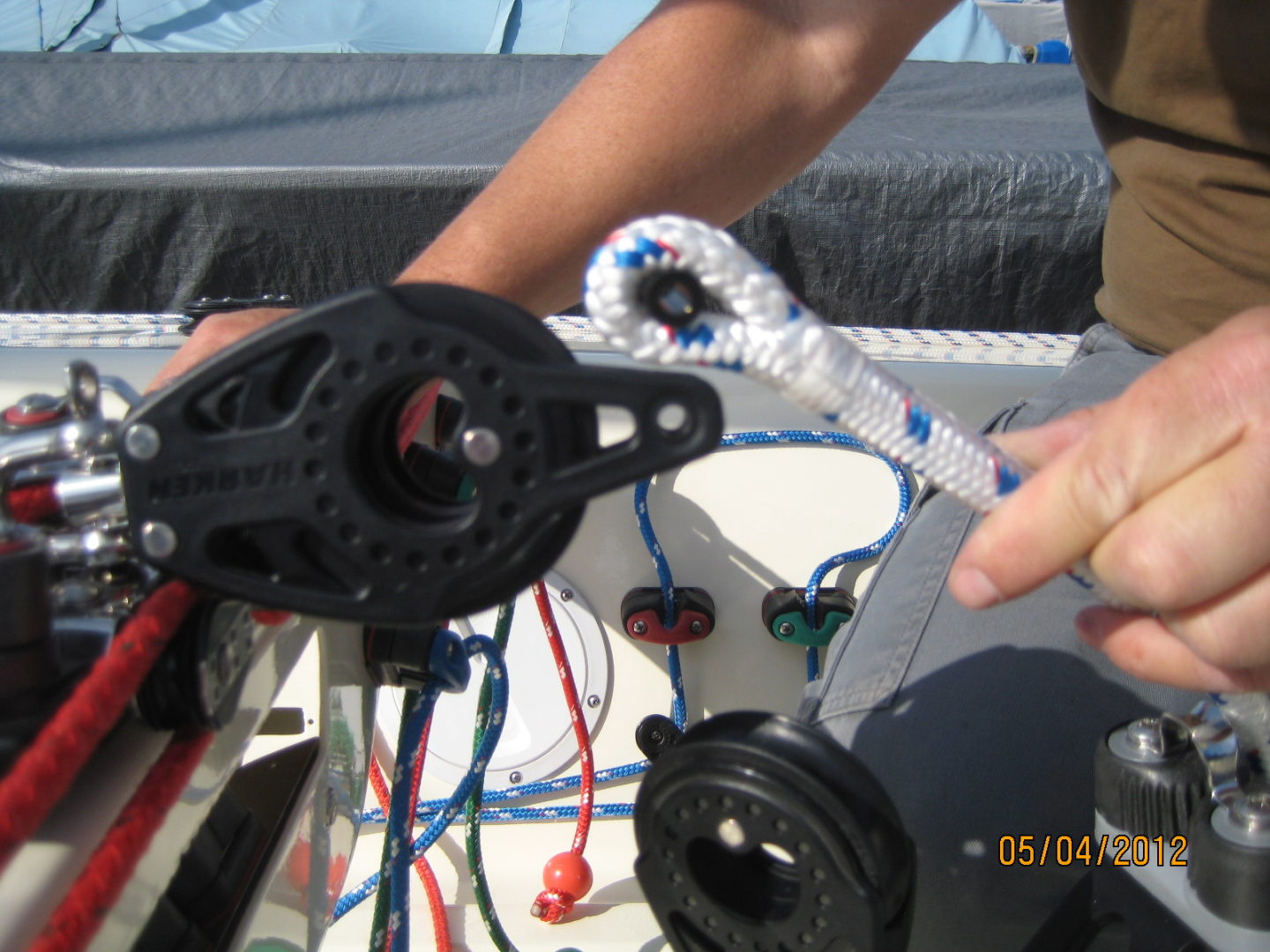 A person is holding onto the rope of a boat.