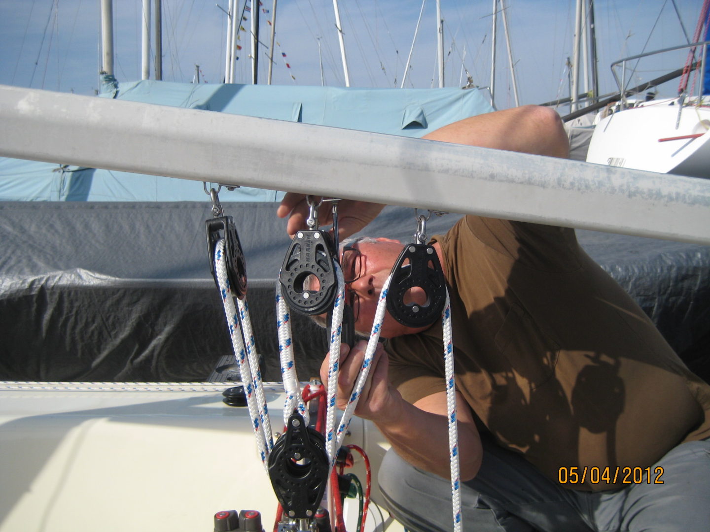 A man working on the side of a boat.