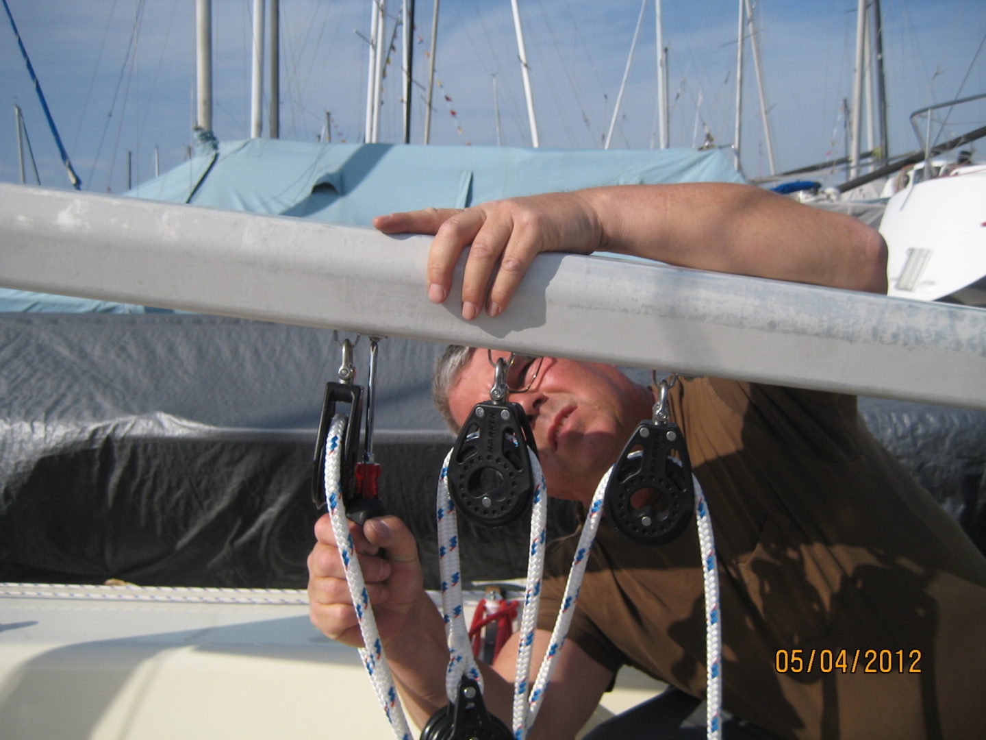 A man working on the side of a boat.