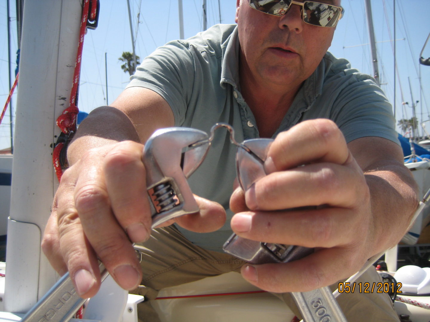 A man holding two different types of electrical devices.