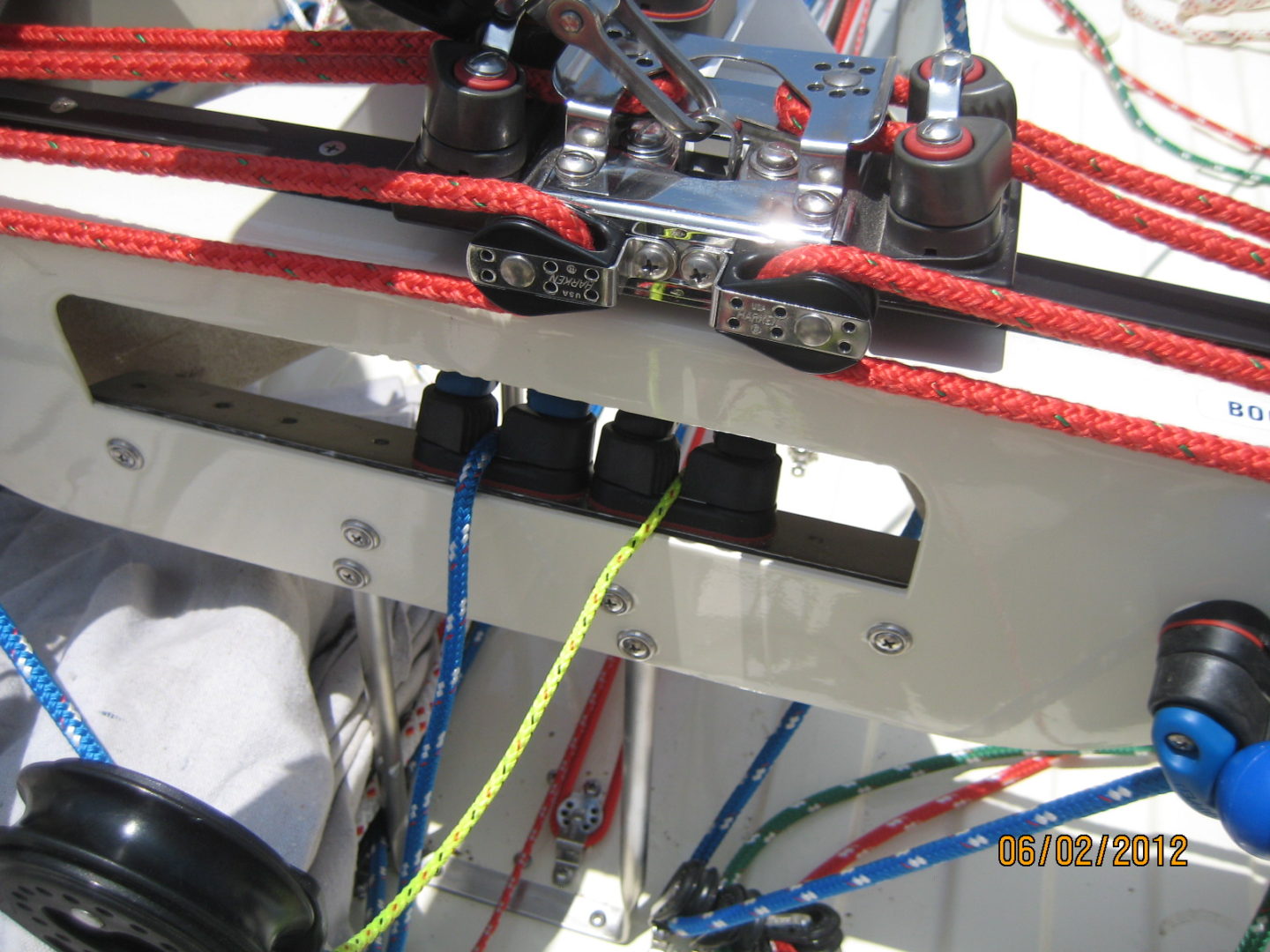 A close up of wires and cables on the side of a boat.