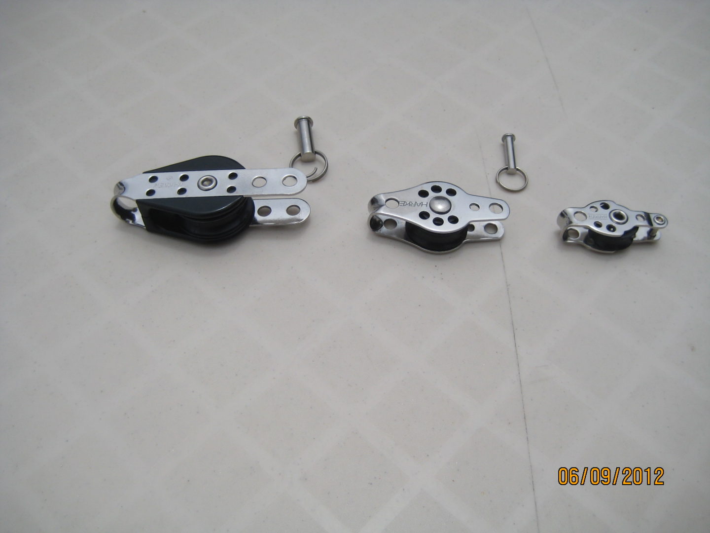 A set of three different types of pulleys.