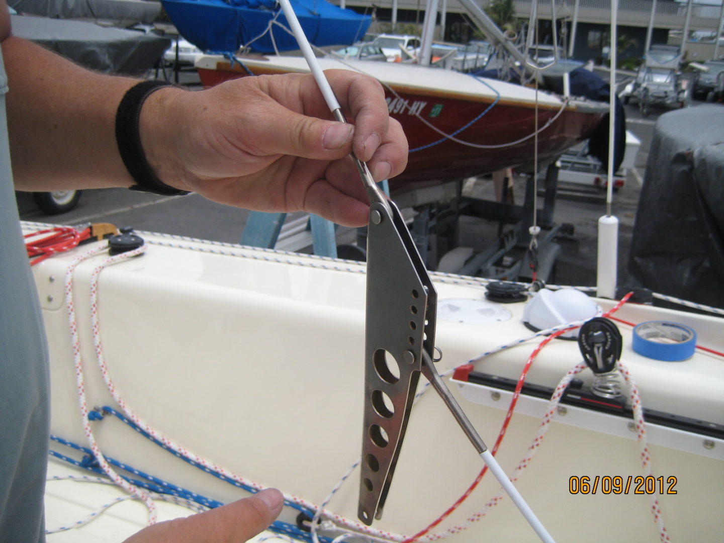 A person holding onto the side of a boat