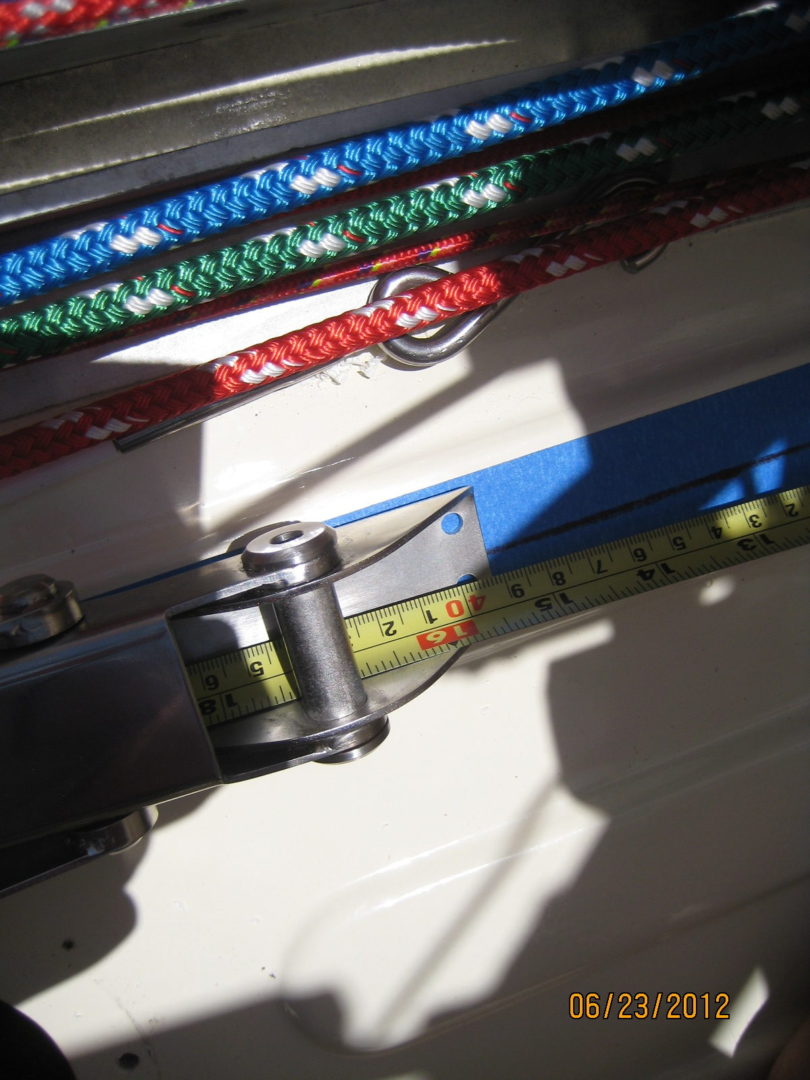 A close up of a pair of skis with a measuring tape