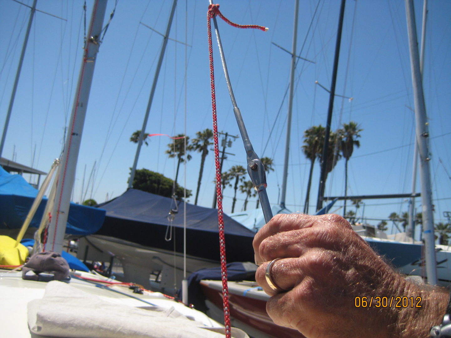 A person holding onto the rope of their boat