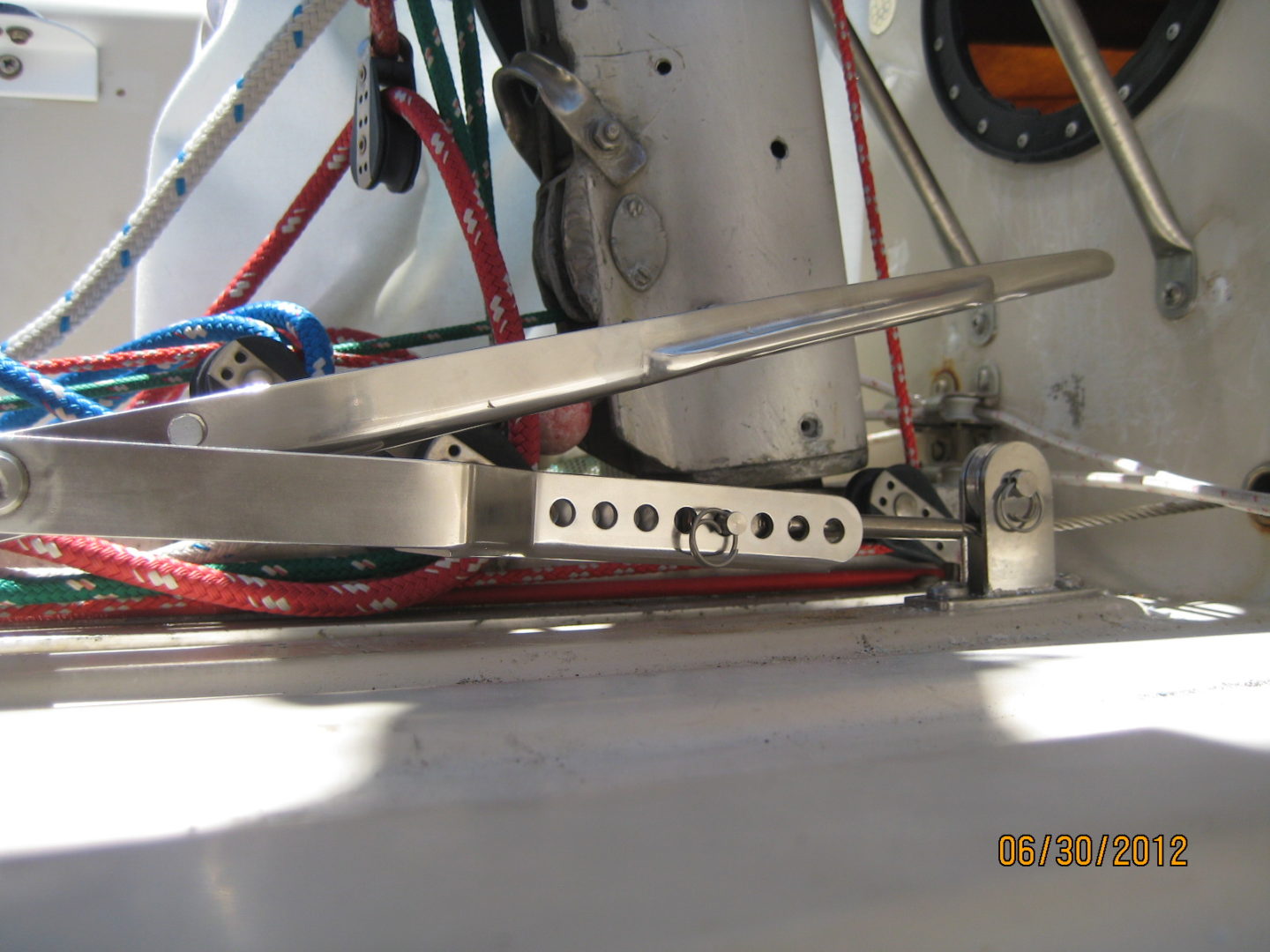 A close up of the side of a boat with wires.