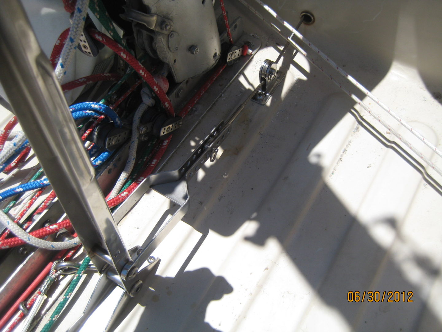 A close up of wires and cables on the side of a boat.