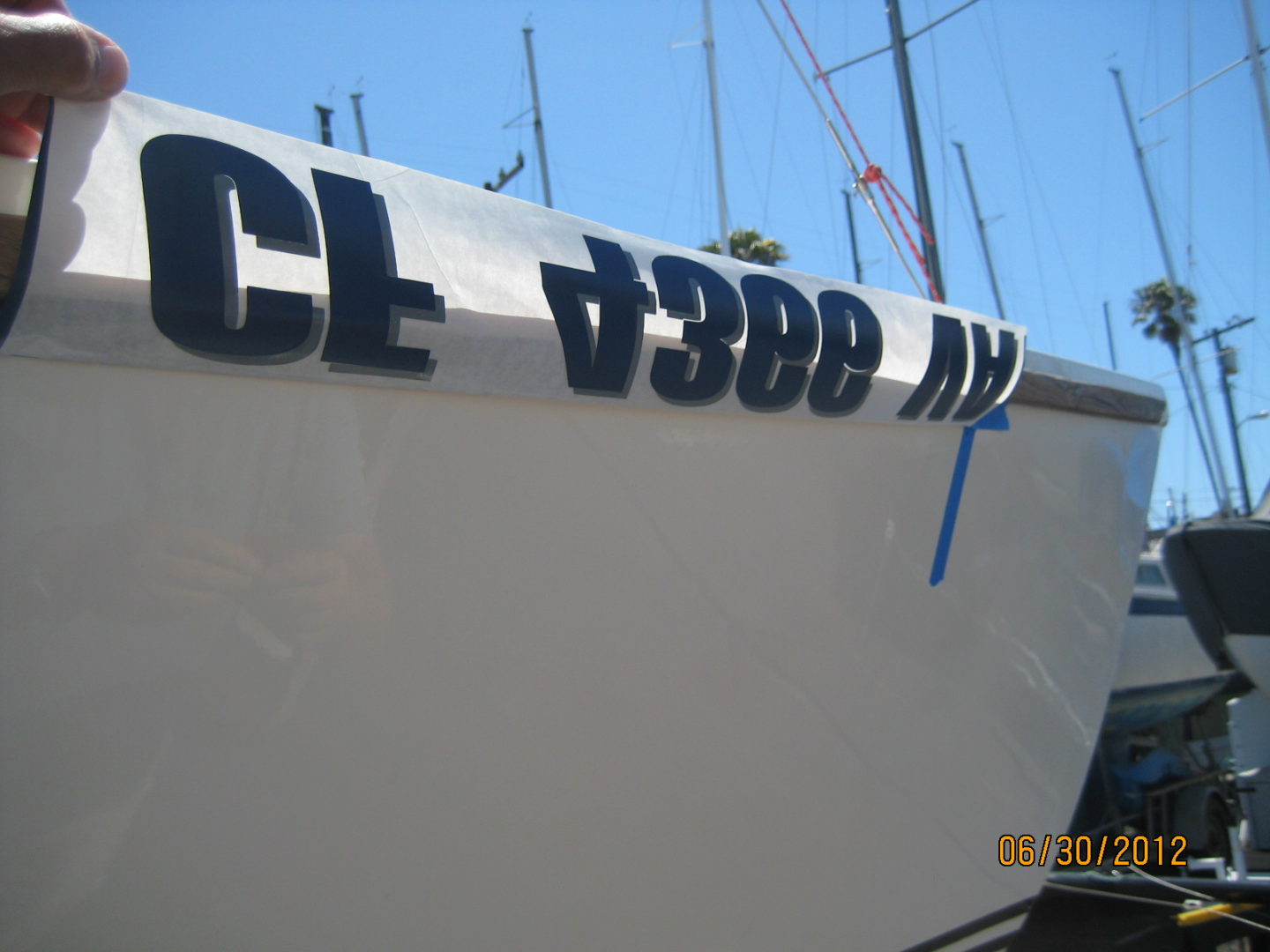 A boat with the words " cl 7 3 8 0 xx " written on it.