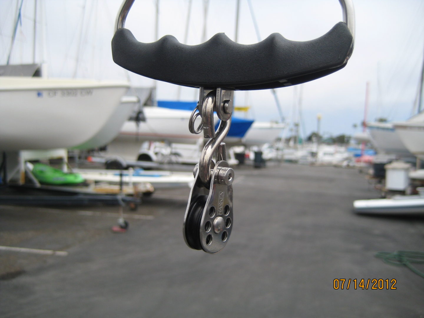 A close up of a chain on the side of a boat.