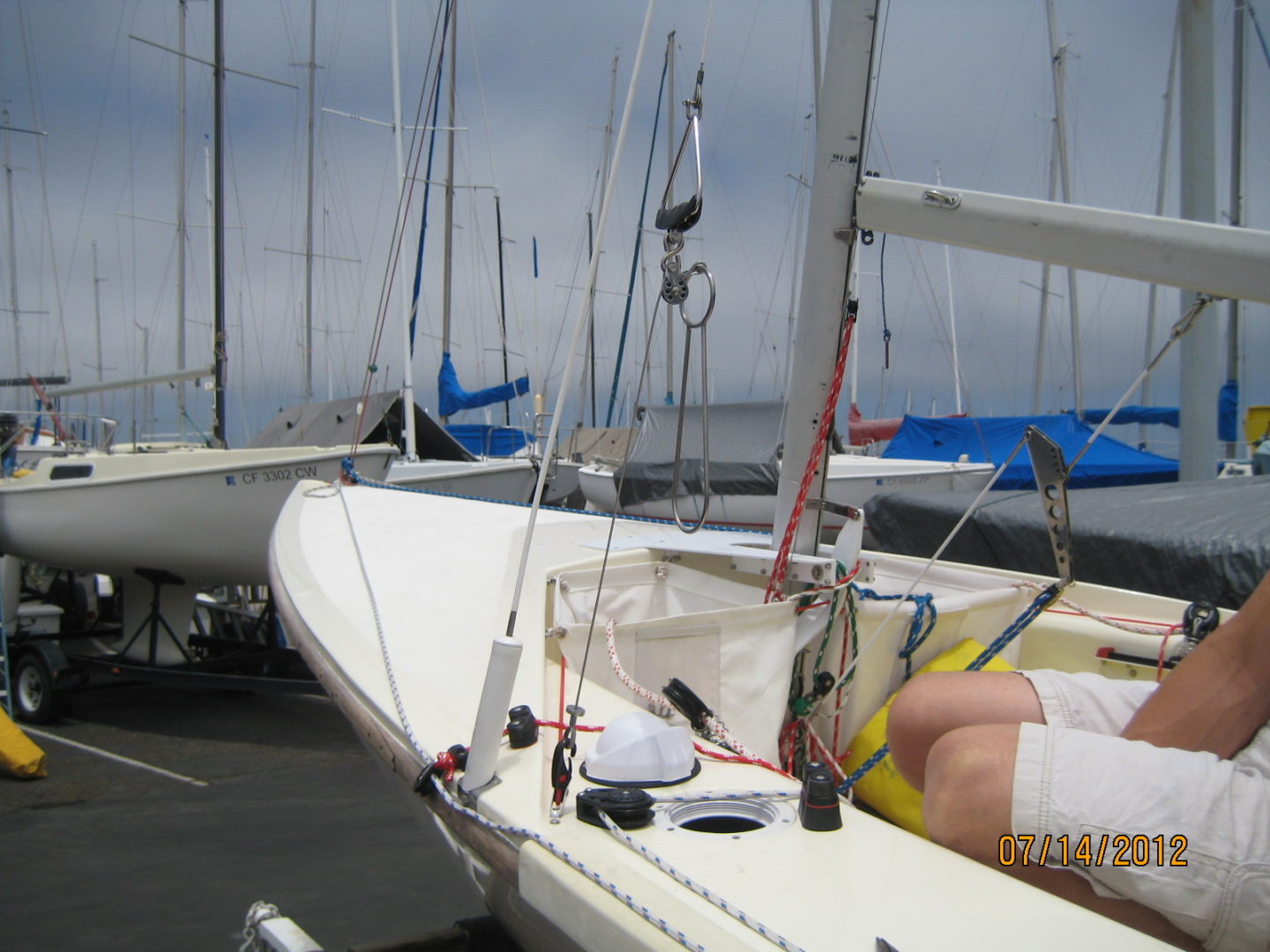 A man sitting on the back of a boat.