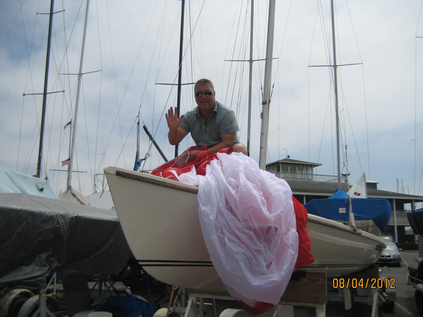 A man sitting on the bow of a boat.