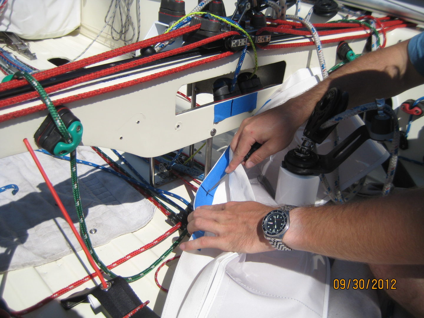 A person working on wires in an electrical box.