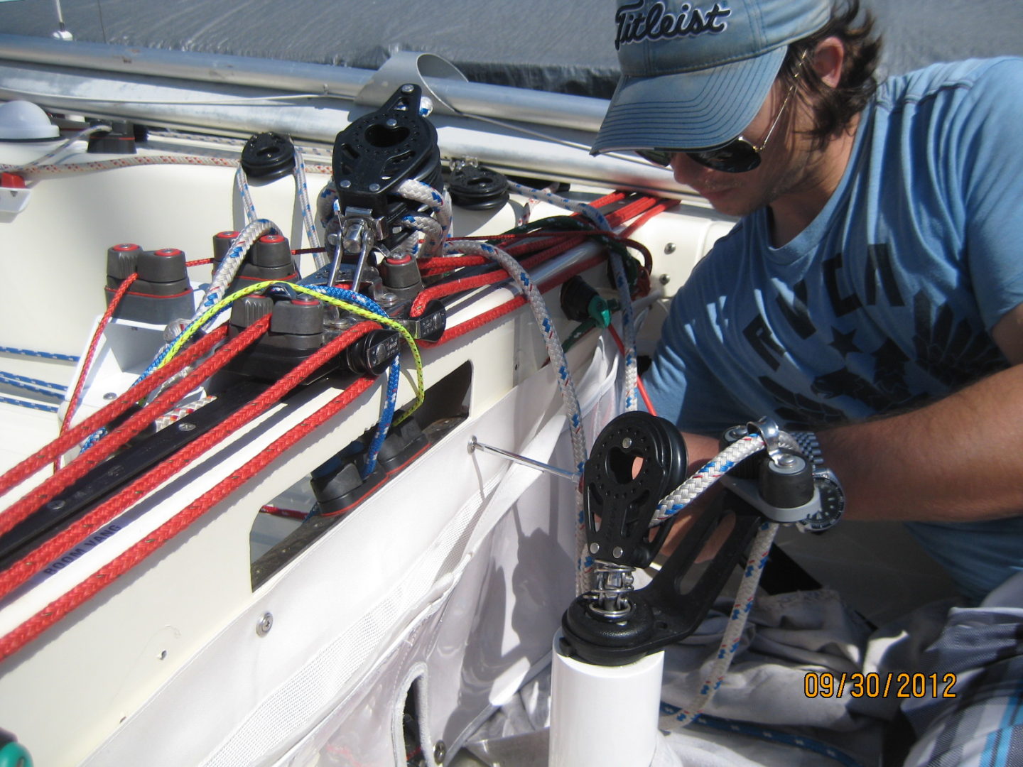 A man working on the side of a boat.