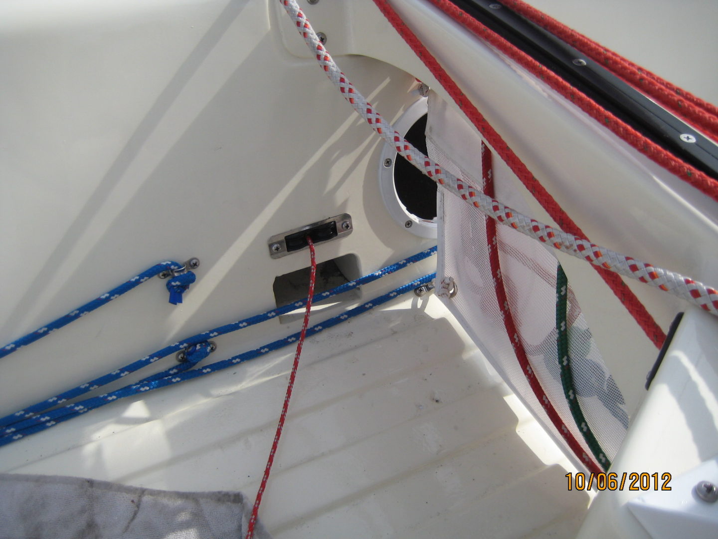 A view of the inside of a boat with ropes.